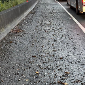 Dozens of tow trucks have been dispatched (Pictured: the metal shards on the road)