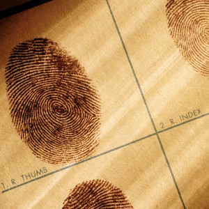 Close-up of inked fingerprints on a fingerprint card, labeled for the right thumb and index finger