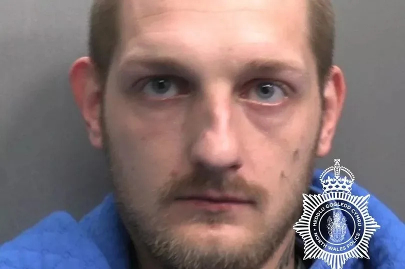 Lee Kutryk, 30, of no fixed address, was jailed for 18 months for robbery in Rhyl